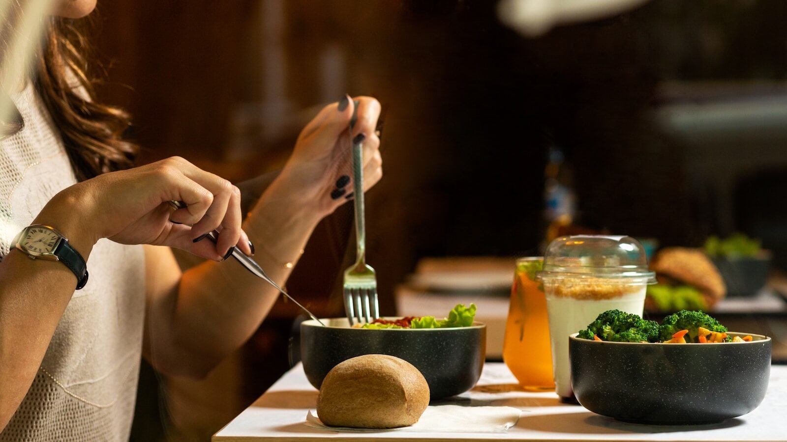 Photo by Farhad Ibrahimzade person holding silver fork and knife